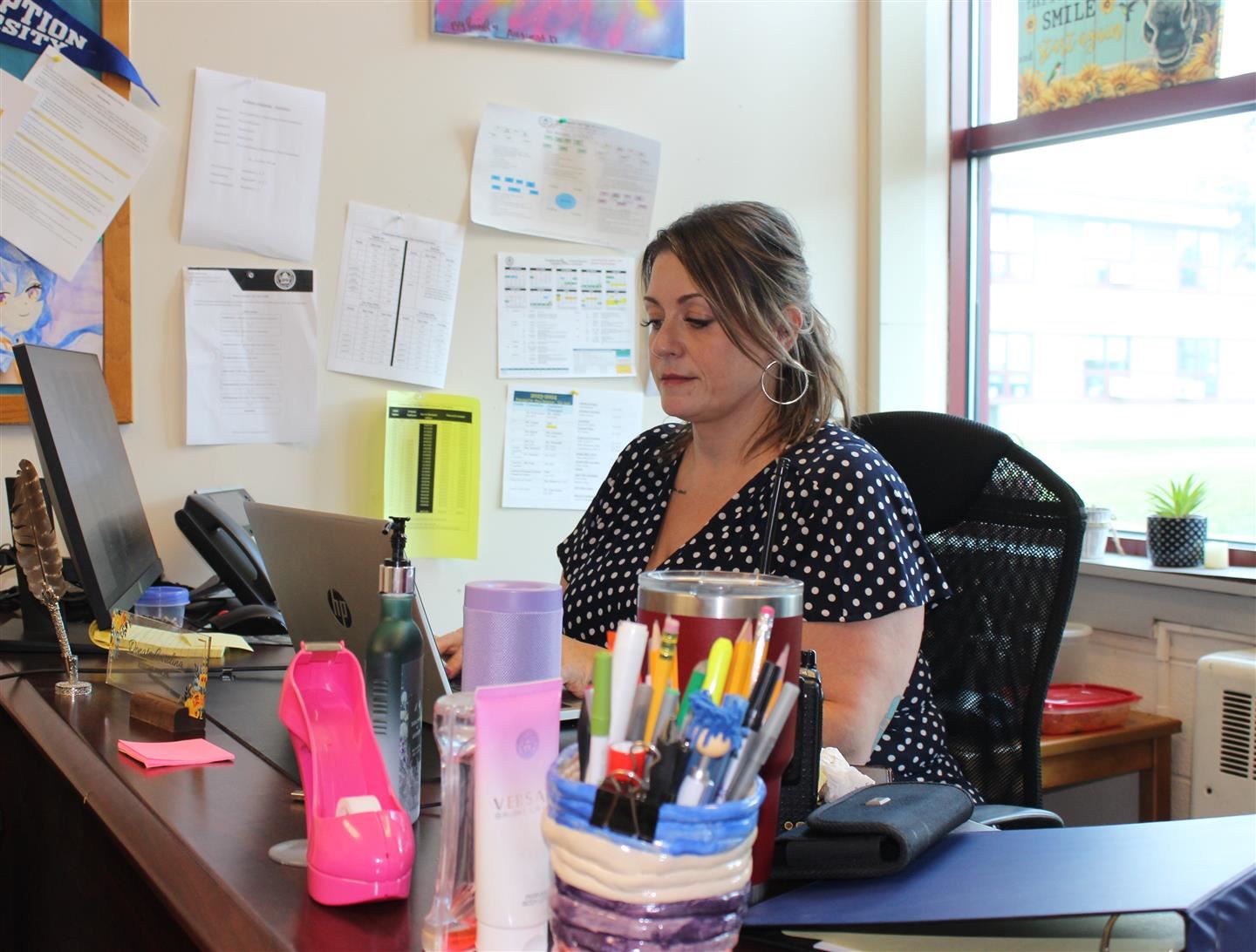  Donata Carolina sits at her desk in Poughkeepsie High School